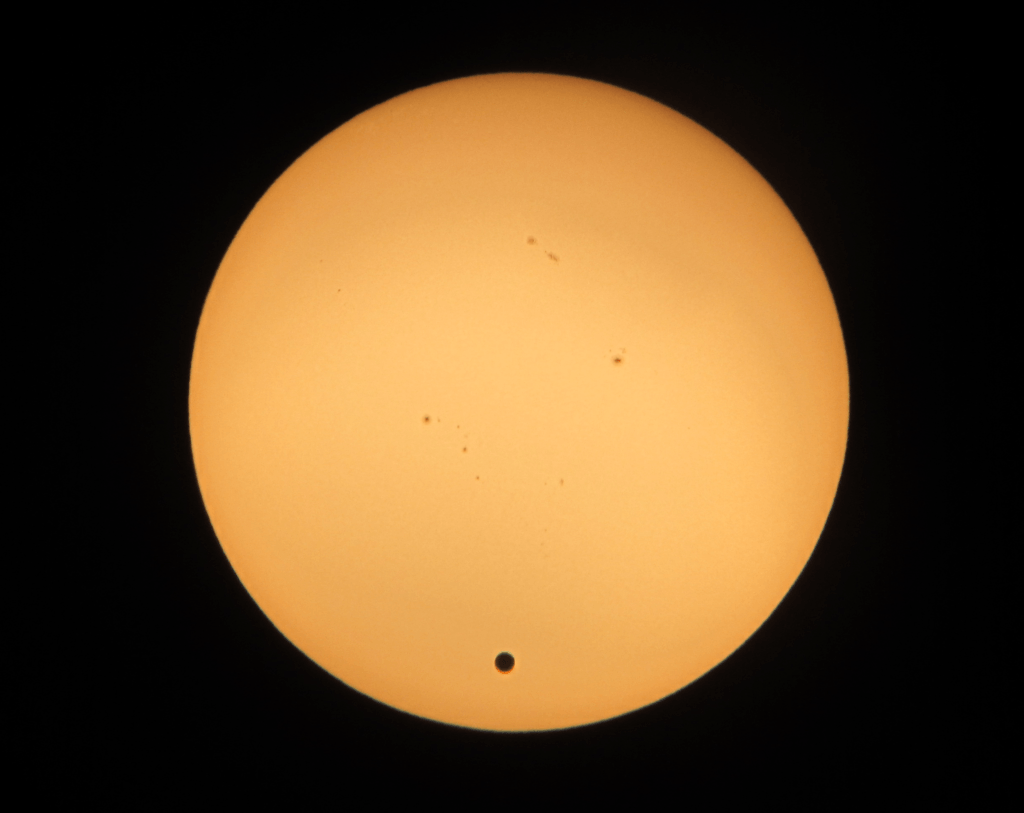 Venusian transit of the sun with a telescope.